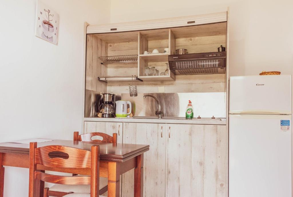 A kitchen or kitchenette at Apagio Apartments