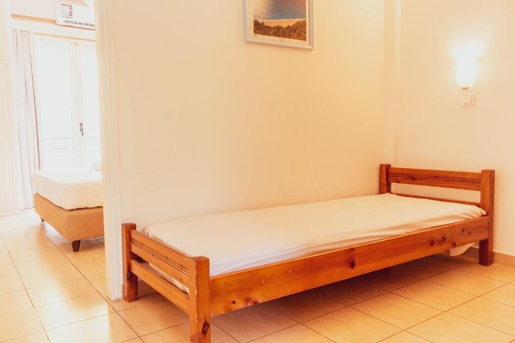 A bed or beds in a room at Apagio Apartments