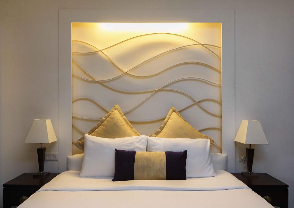 Postel nebo postele na pokoji v ubytování Sonesta Inns Beach Resort - Candolim Beach