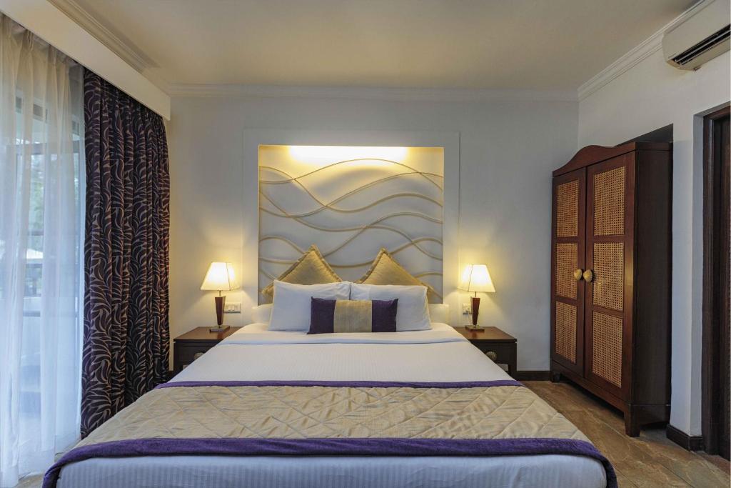 Postel nebo postele na pokoji v ubytování Sonesta Inns Beach Resort - Candolim Beach