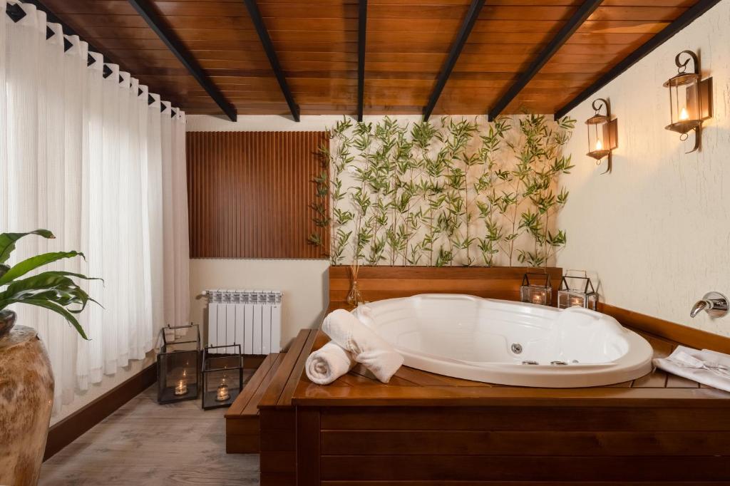 Postel nebo postele na pokoji v ubytování Hotel Vivenda dos Sonhos
