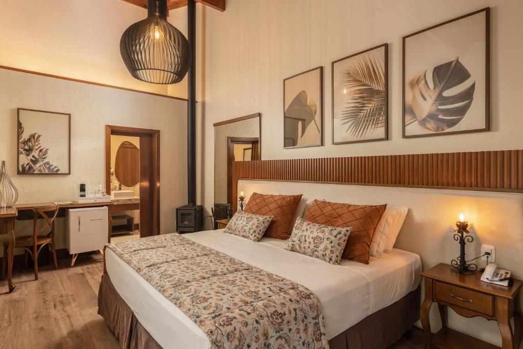 Postel nebo postele na pokoji v ubytování Hotel Vivenda dos Sonhos