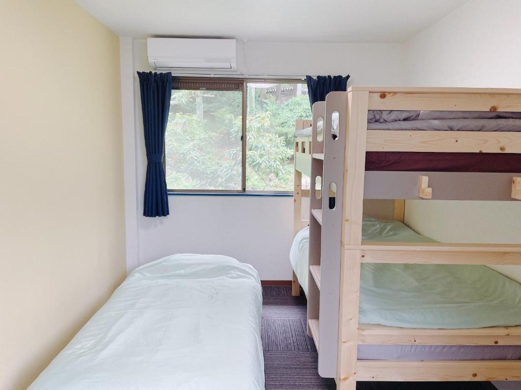 a small room with two bunk beds and a window at Cate no mori - Vacation STAY 21108v in Shime