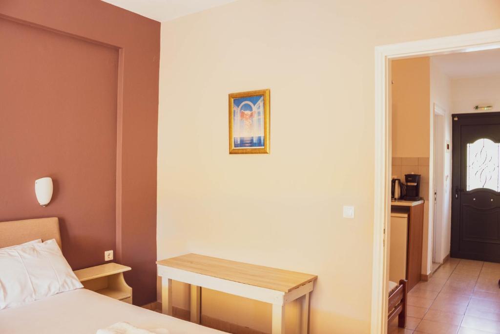 A bed or beds in a room at Apagio Apartments