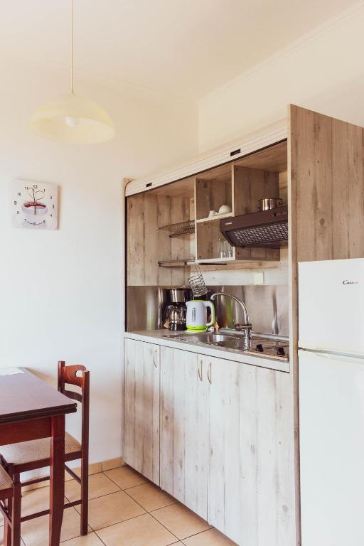 A kitchen or kitchenette at Apagio Apartments