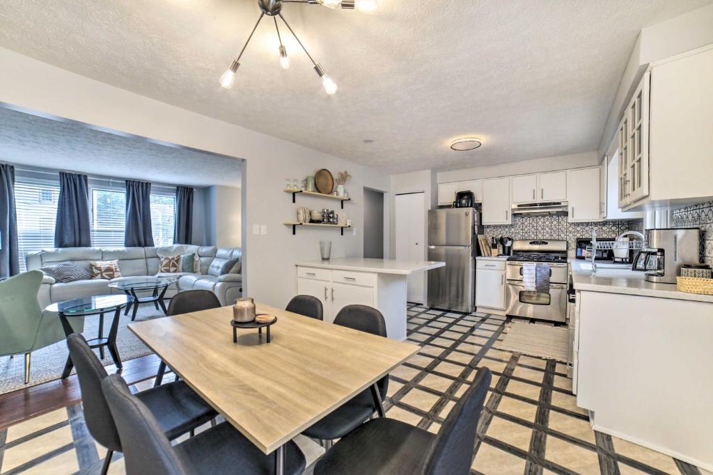 a kitchen and living room with a table and chairs at Pittsburgh Retreat with Deck about 4 Mi to Dtwn! in Pittsburgh