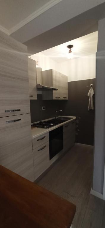 A kitchen or kitchenette at La nostra casetta