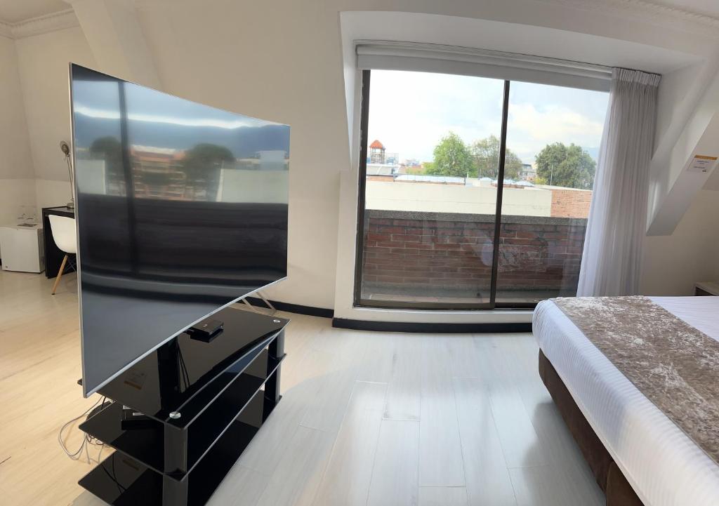 TV a/nebo společenská místnost v ubytování Suites 109 GH Usaquén
