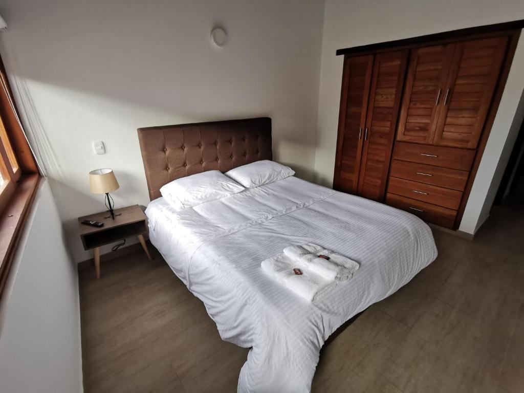 Postel nebo postele na pokoji v ubytování Casa ONCE ONCE