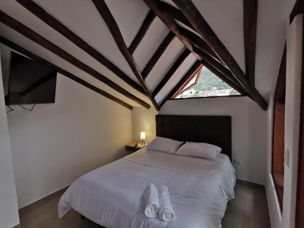 Postel nebo postele na pokoji v ubytování Casa ONCE ONCE