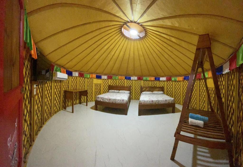 Postel nebo postele na pokoji v ubytování El Valle Resort & Spa - Aguas Termales