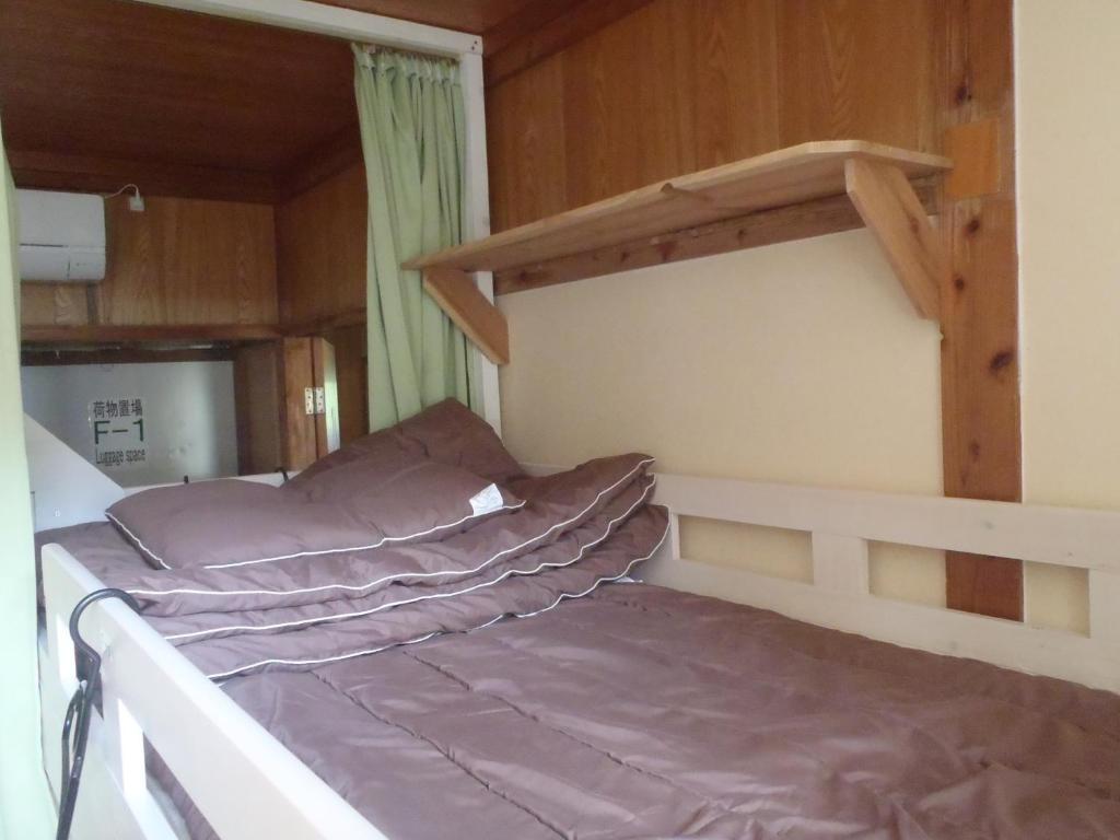 Postel nebo postele na pokoji v ubytování Kerama Backpackers
