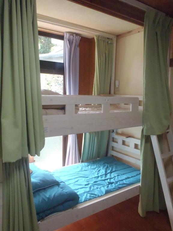 Postel nebo postele na pokoji v ubytování Kerama Backpackers