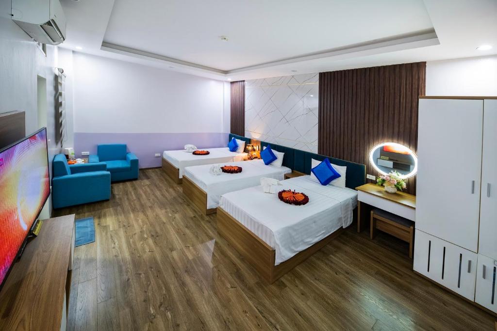 Postel nebo postele na pokoji v ubytování Aquarius Grand Hotel