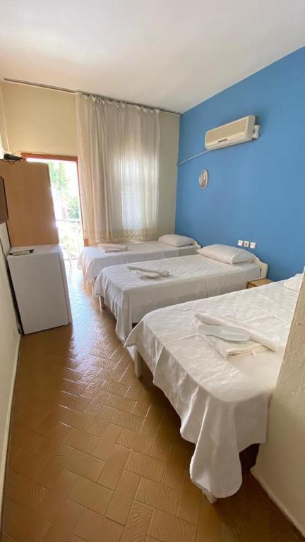 A bed or beds in a room at Saray Otel