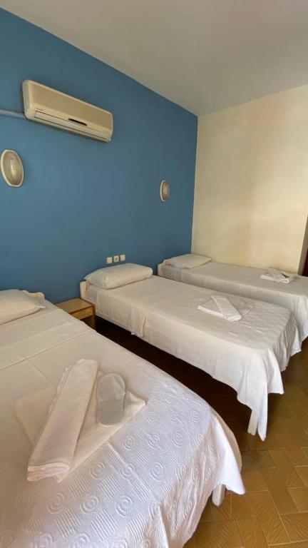 A bed or beds in a room at Saray Otel