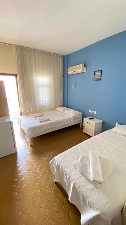 A bed or beds in a room at Saray Otel
