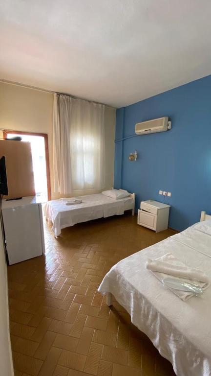 A bed or beds in a room at Saray Otel