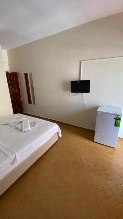 A bed or beds in a room at Saray Otel