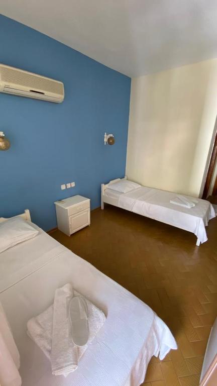 A bed or beds in a room at Saray Otel