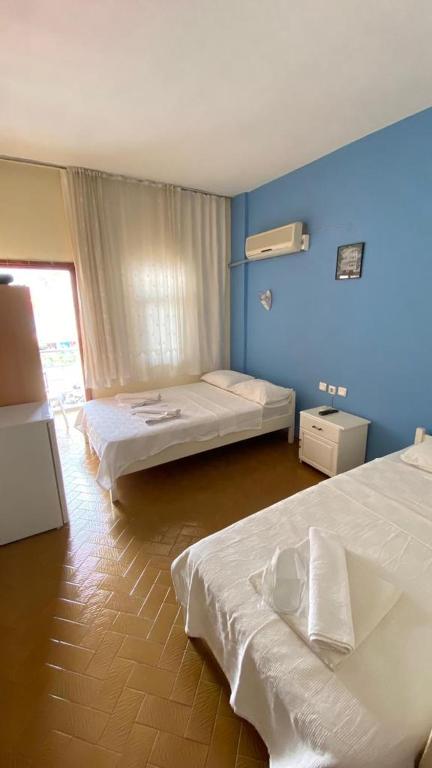 A bed or beds in a room at Saray Otel