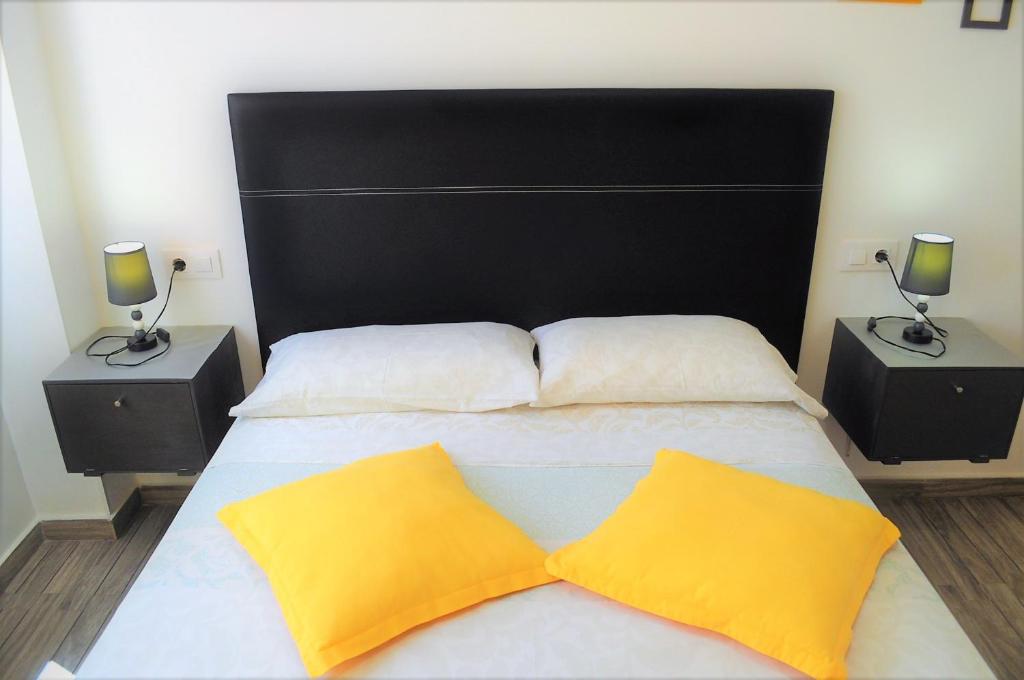 Postel nebo postele na pokoji v ubytování Cris Sol Apartments