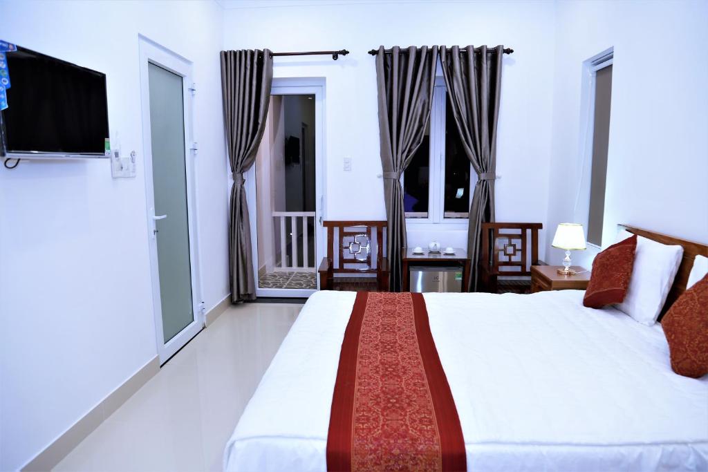 Postel nebo postele na pokoji v ubytování Red House Homestay - Villa