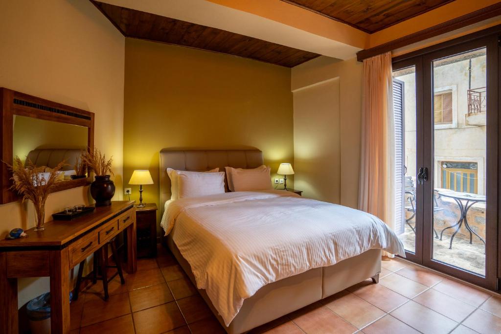 Postel nebo postele na pokoji v ubytování Guesthouse Laoula