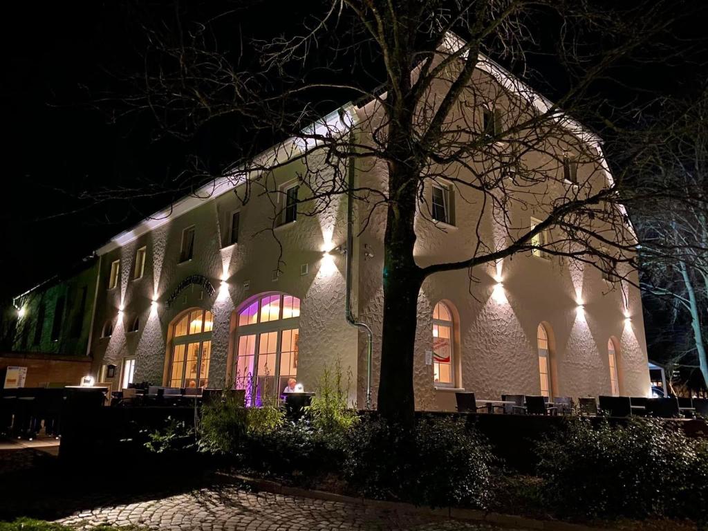 a building lit up at night with lights at Eschberger Hof in Saarbrücken