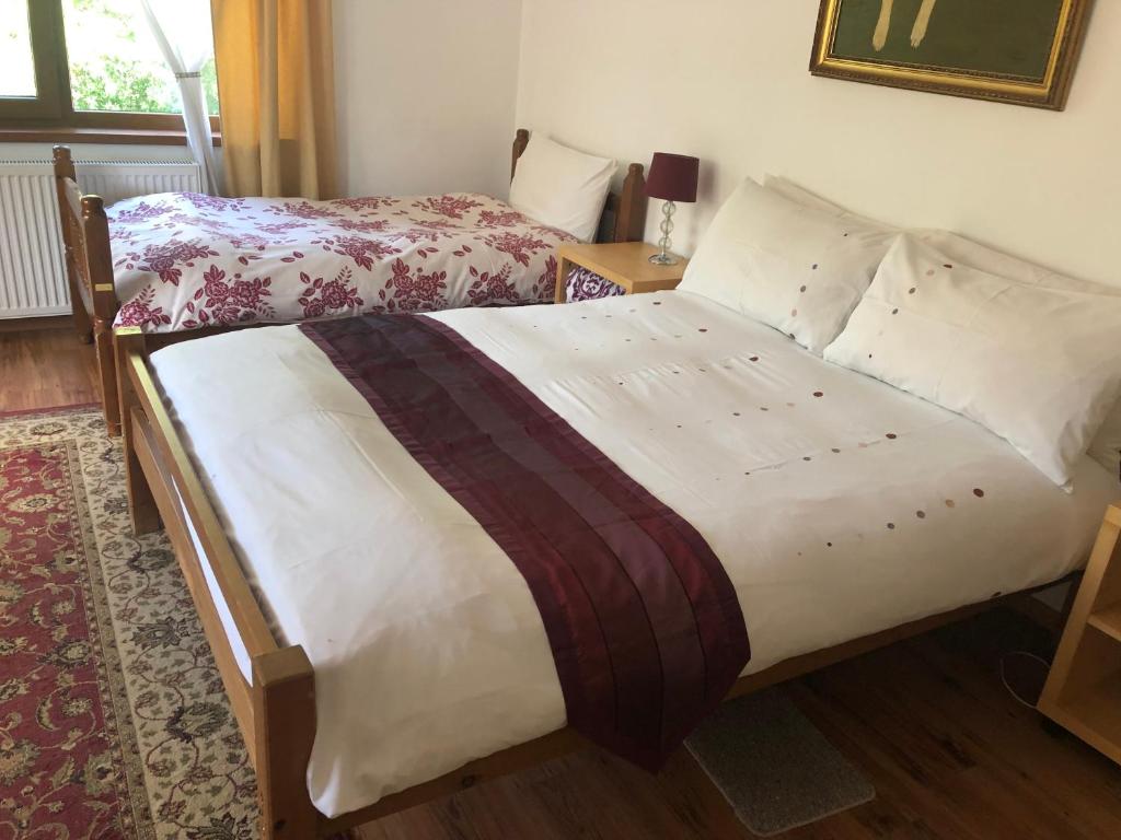 a bed in a room with two beds in it at Cabana Sweetlife in Rimetea