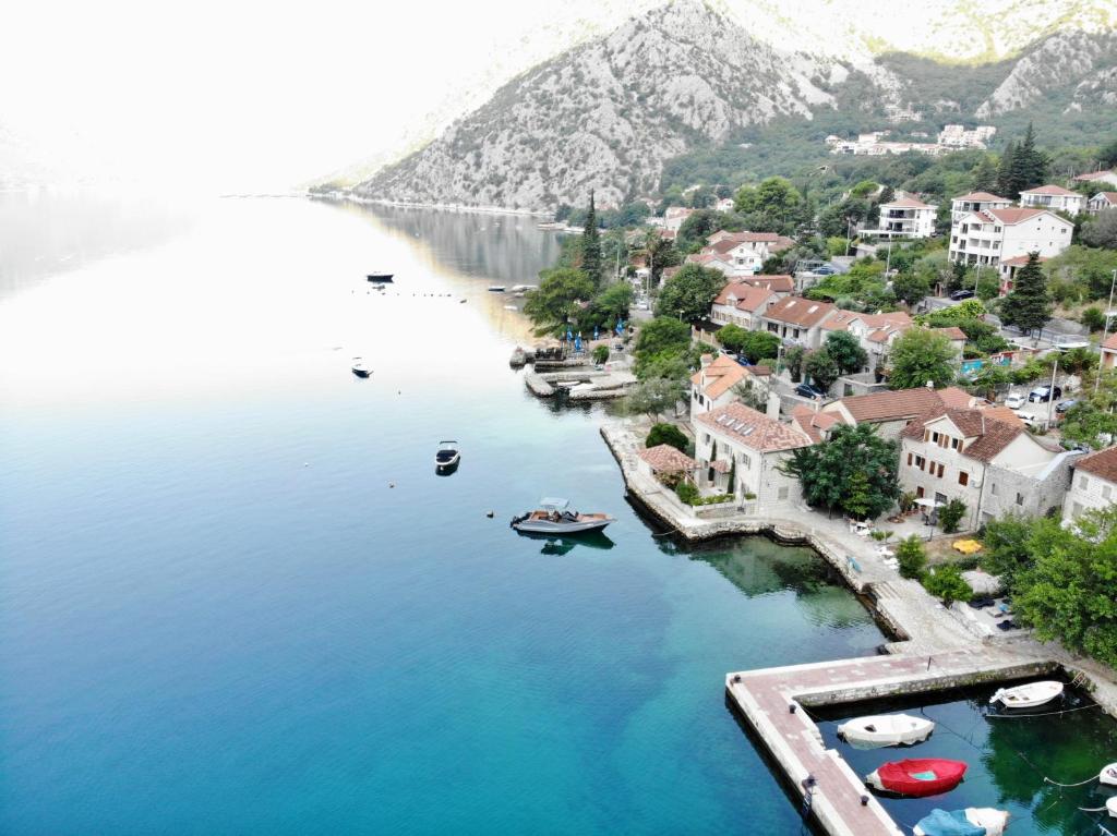 an aerial view of a town on the water with boats at Seaside dream in Trstenik
