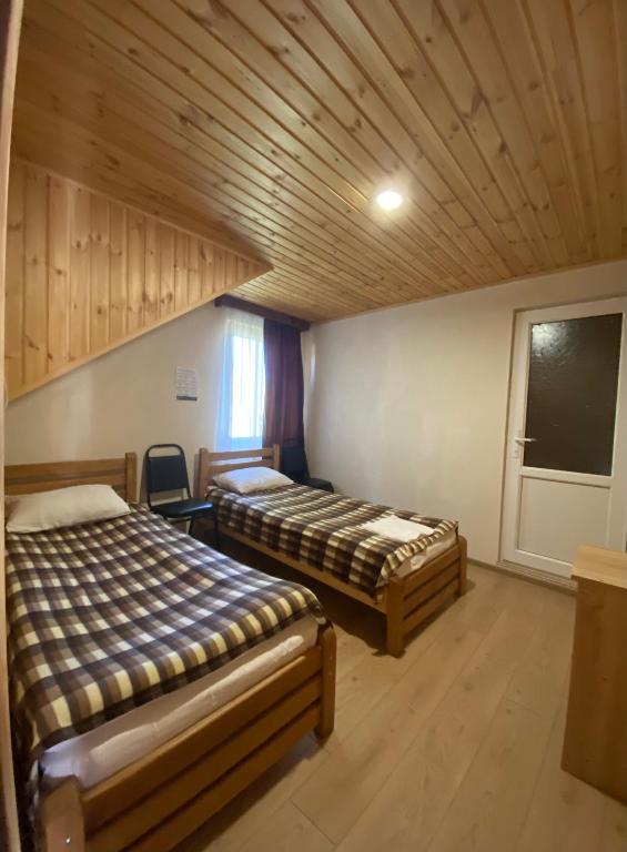 Postel nebo postele na pokoji v ubytování Guest House Gordila