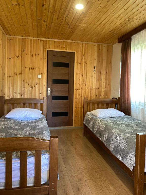 Postel nebo postele na pokoji v ubytování Guest House Gordila