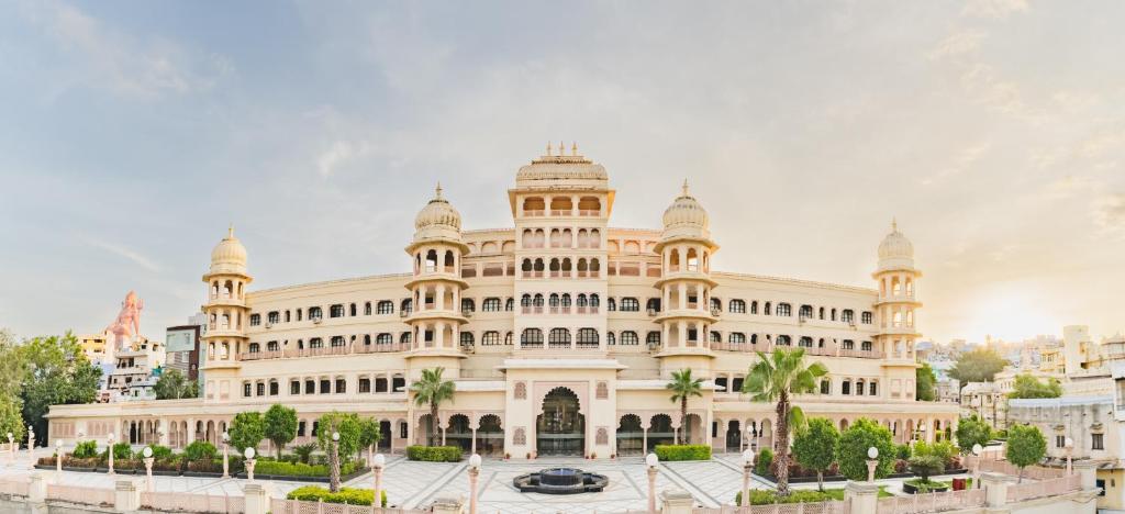 a large white building with a lot of windows at Shree Vallabh Vilas Lords Plaza in Eklingji