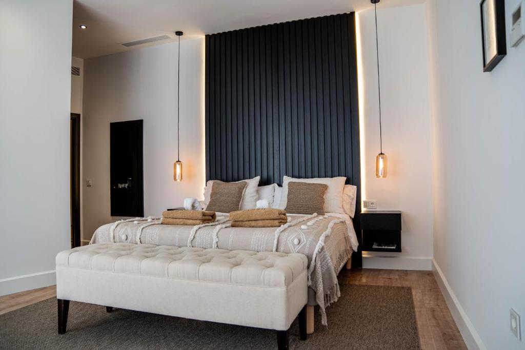 a bedroom with a large bed and a large window at Casa Bodhi Boutique Hotel & Spa in Marbella