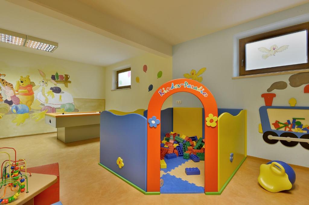 a childs room with a play room with a play set at Appartements Schedererhaus in Going