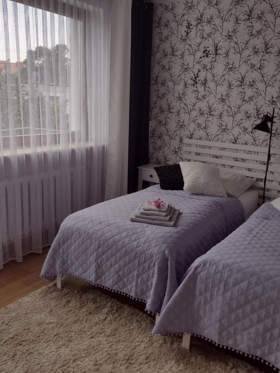 Posteľ alebo postele v izbe v ubytovaní Apartament nad Jeziorakiem