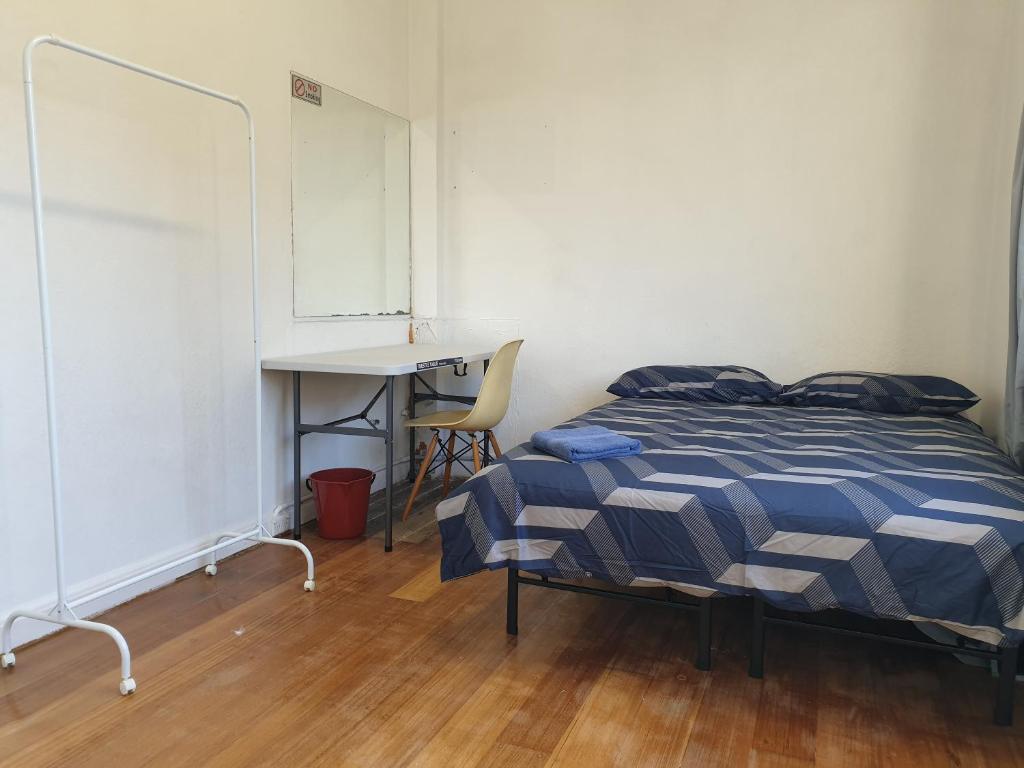 Postel nebo postele na pokoji v ubytování Richmond Private Rooms - 151 Hoddle Homestay