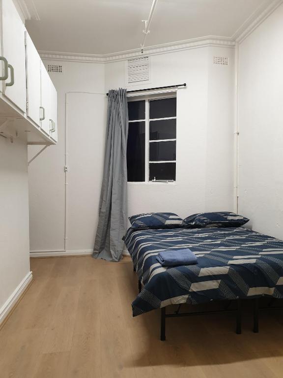 Postel nebo postele na pokoji v ubytování Richmond Private Rooms - 151 Hoddle Homestay