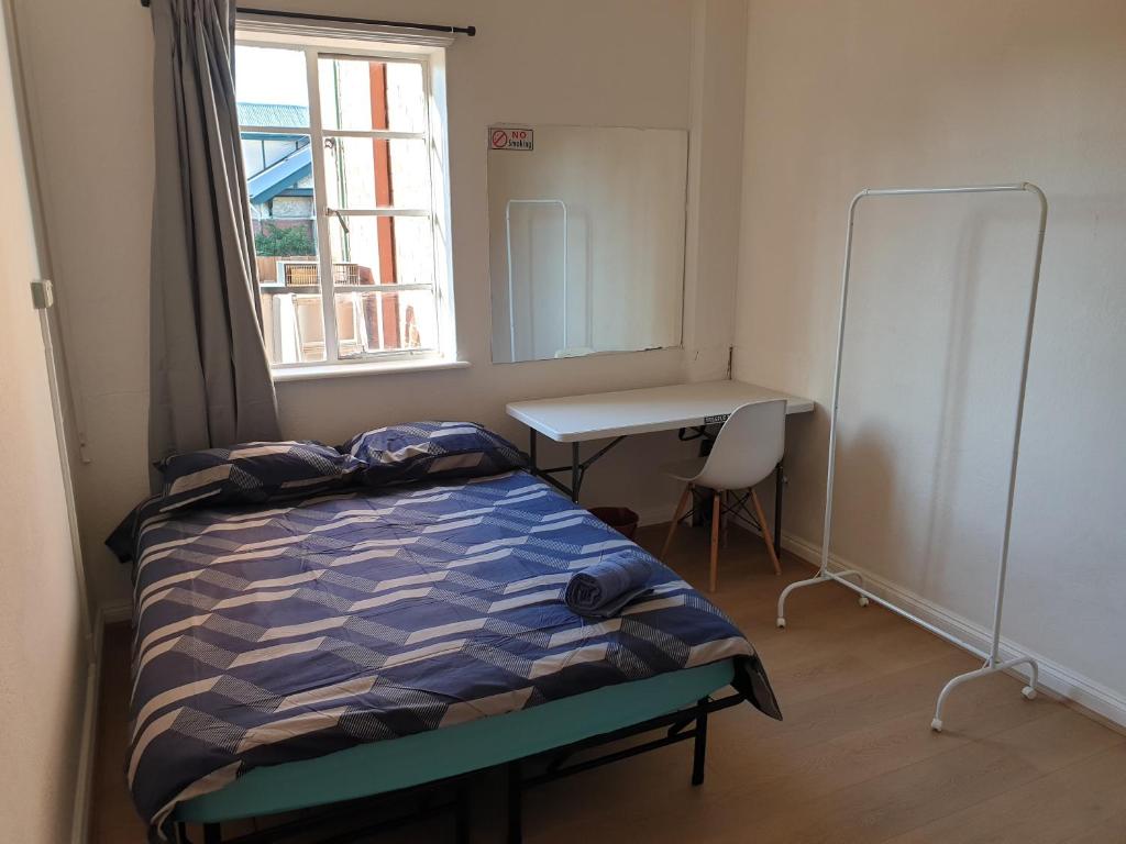 Postel nebo postele na pokoji v ubytování Richmond Private Rooms - 151 Hoddle Homestay