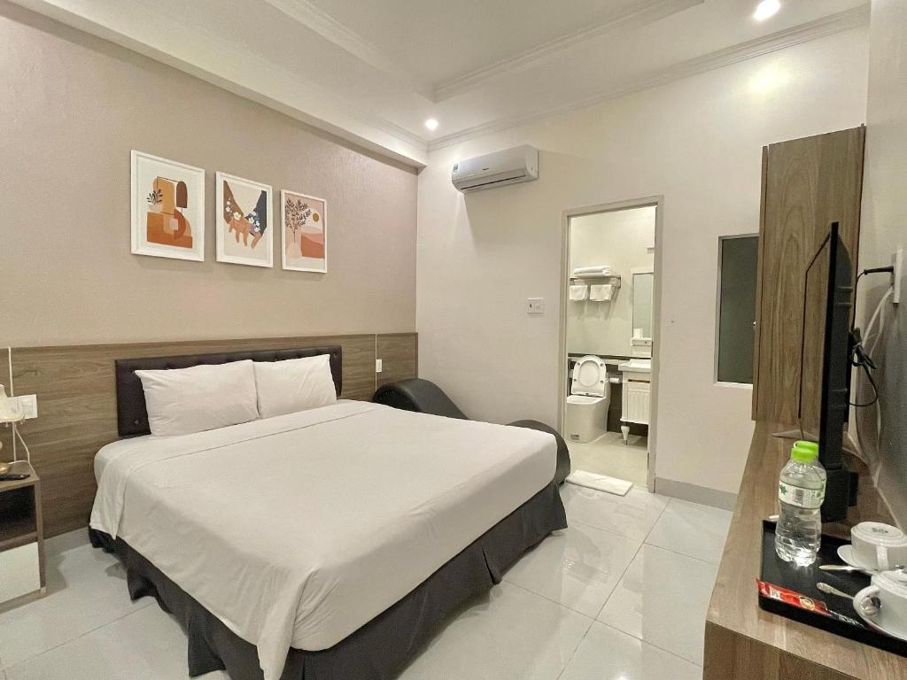 Postel nebo postele na pokoji v ubytování Amora Hotel & Apartment
