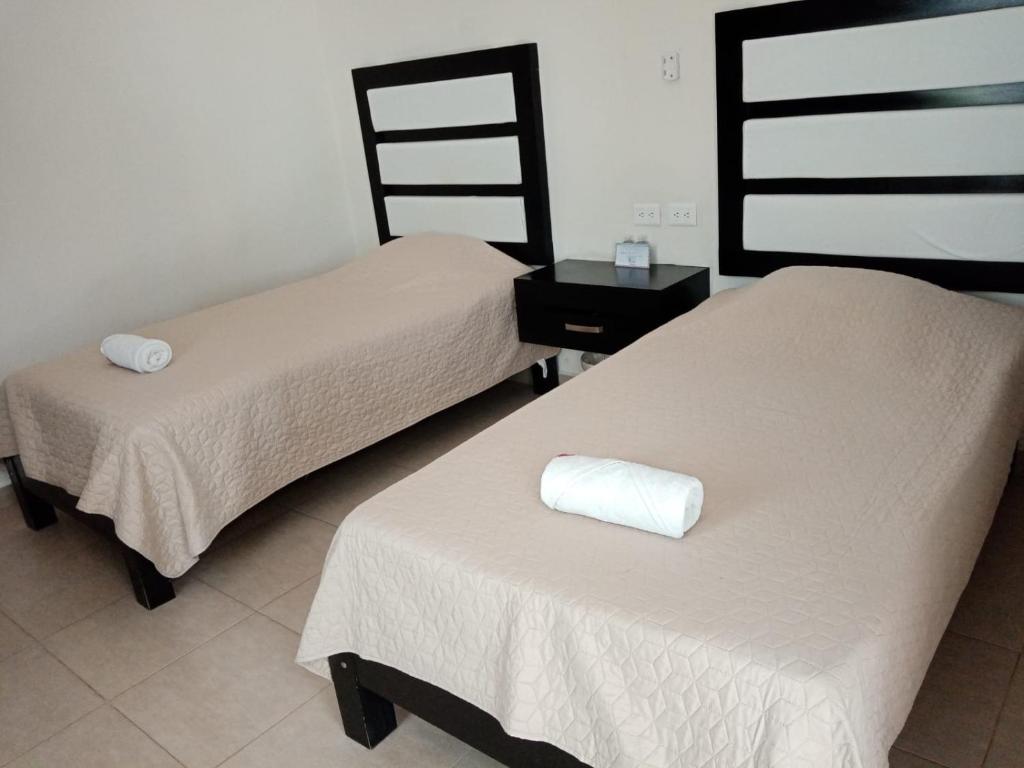 Postel nebo postele na pokoji v ubytování Hotel Sevilla Palenque
