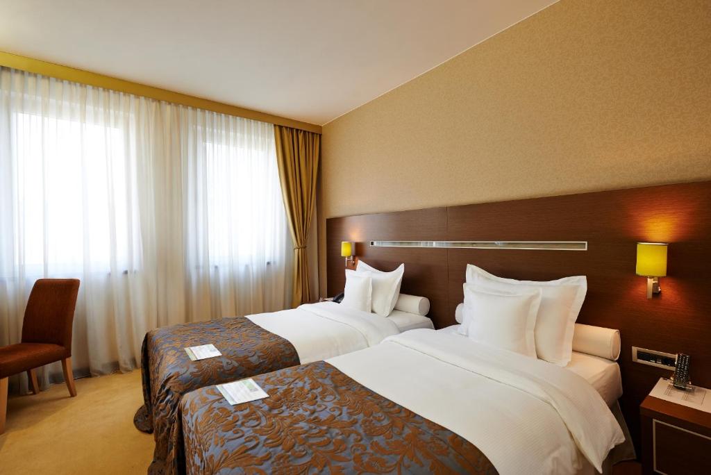 Krevet ili kreveti u jedinici u okviru objekta IN Hotel Beograd