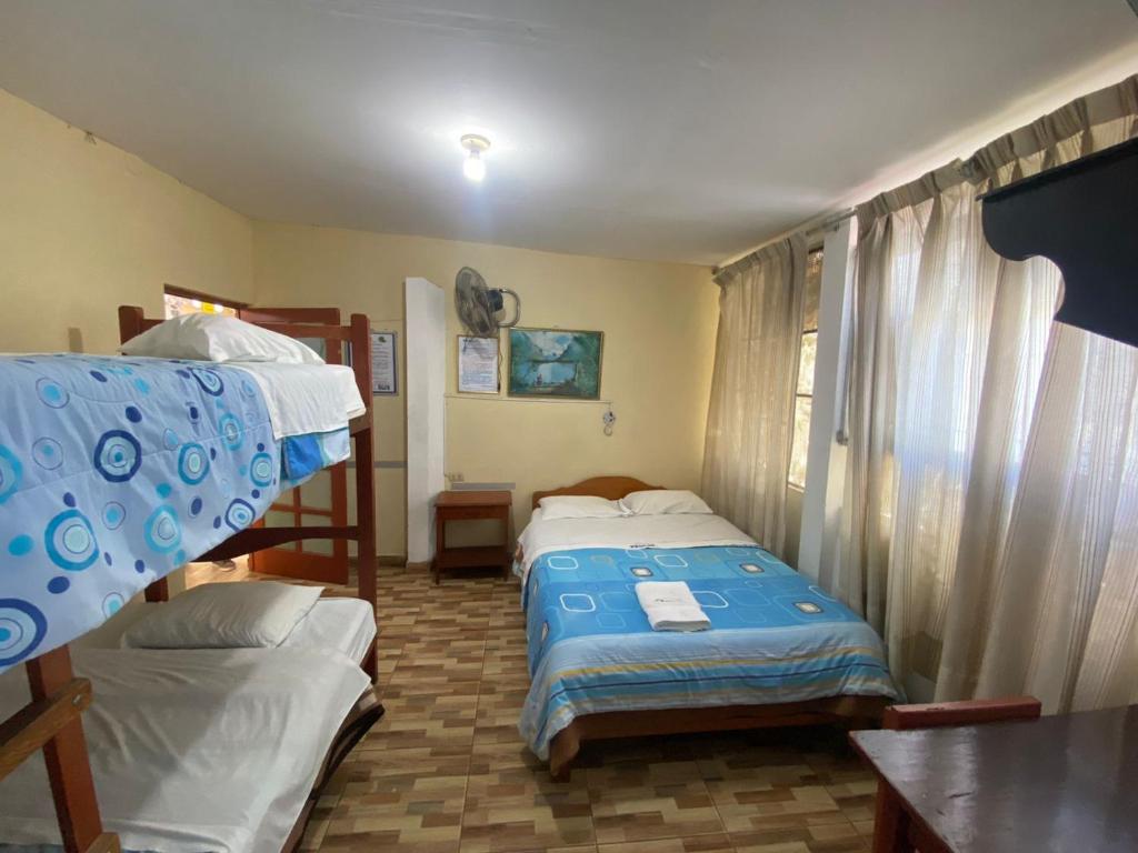 Postel nebo postele na pokoji v ubytování HOSTAL HOGAR 3 Estrellas - CHEPÉN