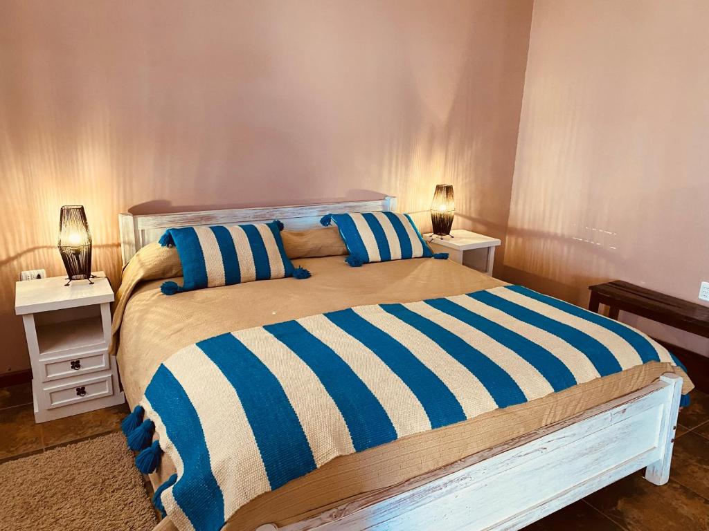 Postel nebo postele na pokoji v ubytování Hostal Katari