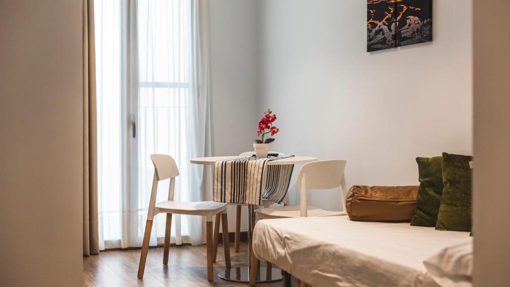 Postel nebo postele na pokoji v ubytování Agusti Hostal