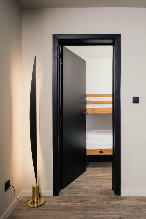 Postel nebo postele na pokoji v ubytování Hotel Au lit des ours