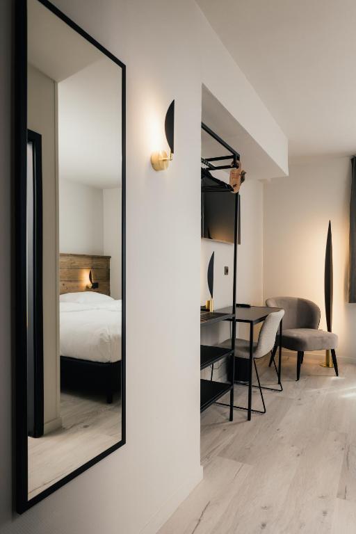 Postel nebo postele na pokoji v ubytování Hotel Au lit des ours