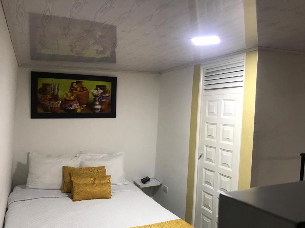 Postel nebo postele na pokoji v ubytování Hotel Casa Nini