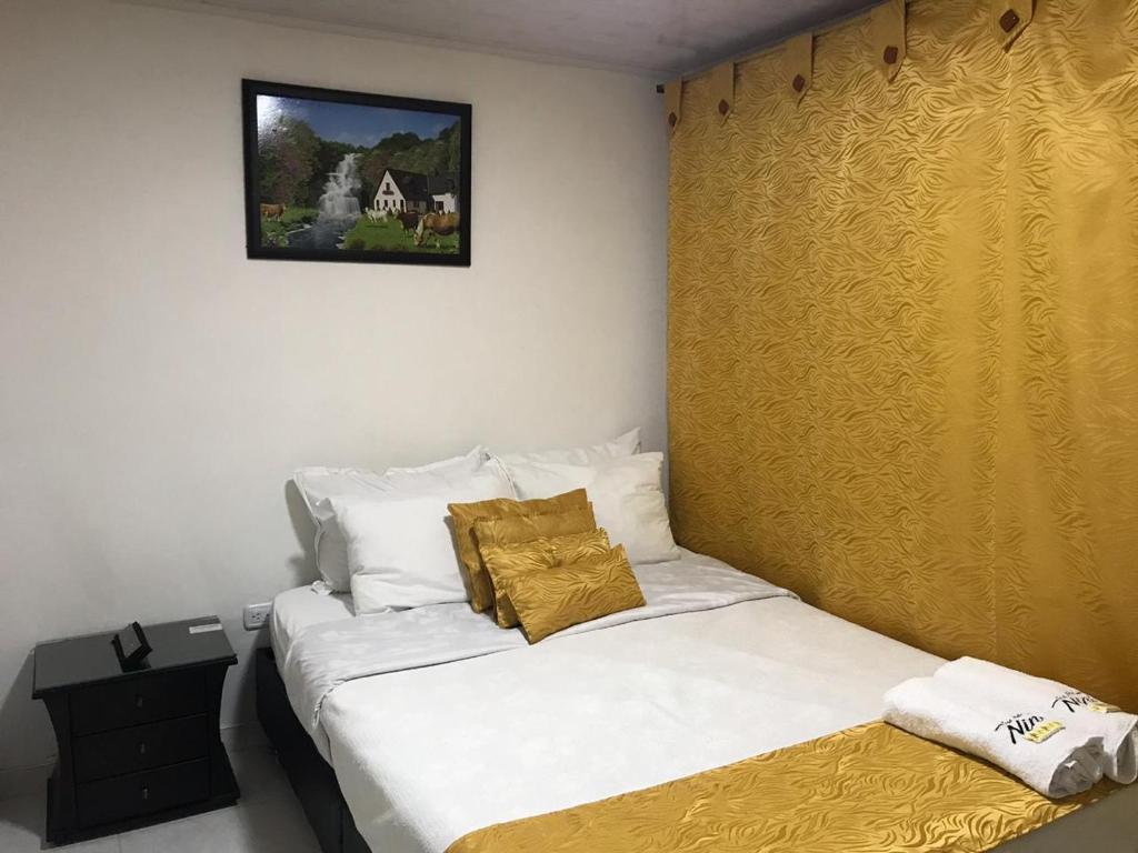 Postel nebo postele na pokoji v ubytování Hotel Casa Nini
